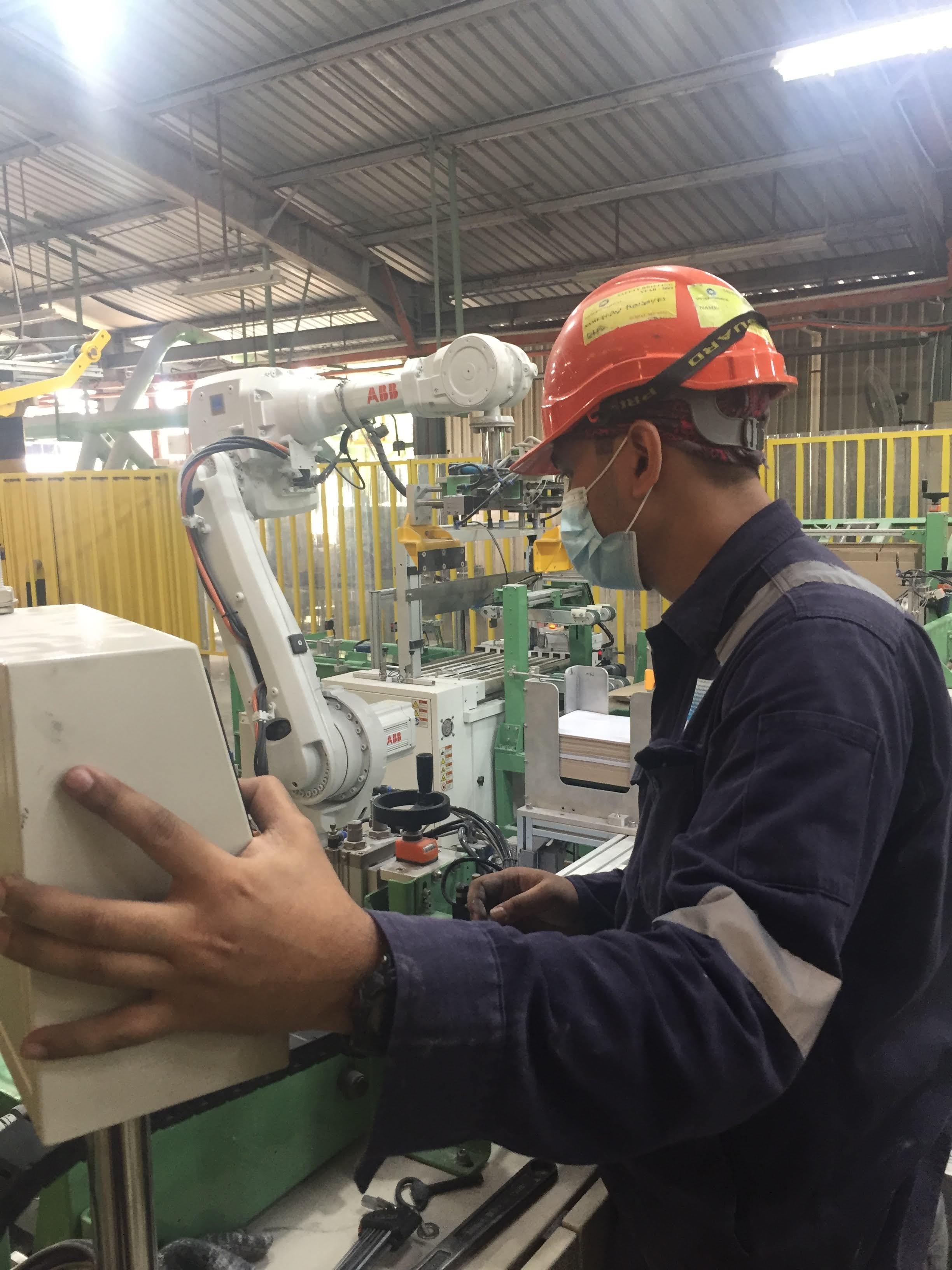 ENZAC technician commissioning the robotic palletizer controller
